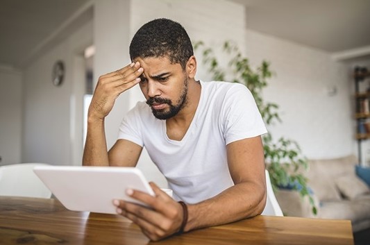 a man worrried with investment decisions during election volatility