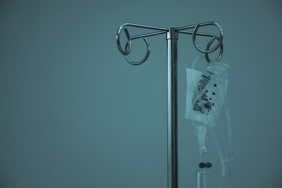 An IV stand with an intravenous fluid bag